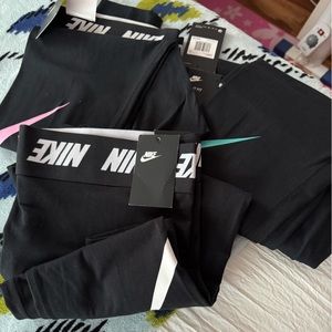 Three pair of Nike leggings size 1x all new with tags.